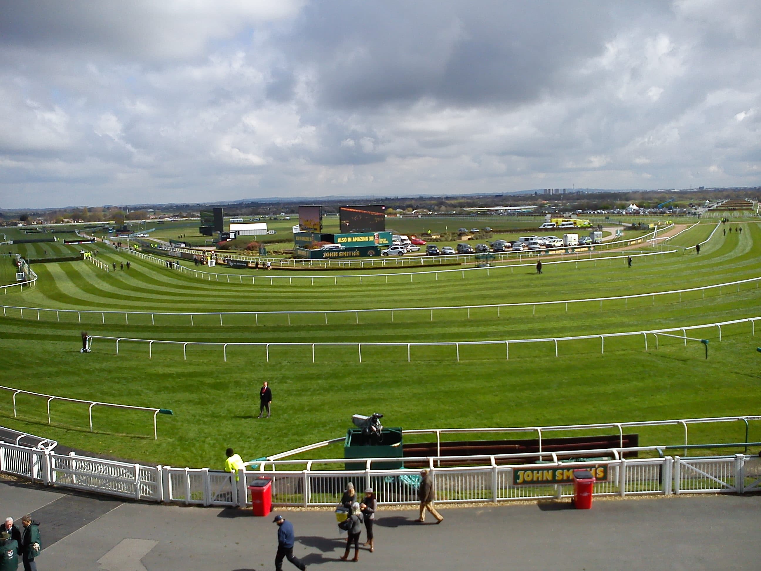 The Mildmay course and the National course at Aintree seen from the stands, with the big screen and the parade ring beyond.