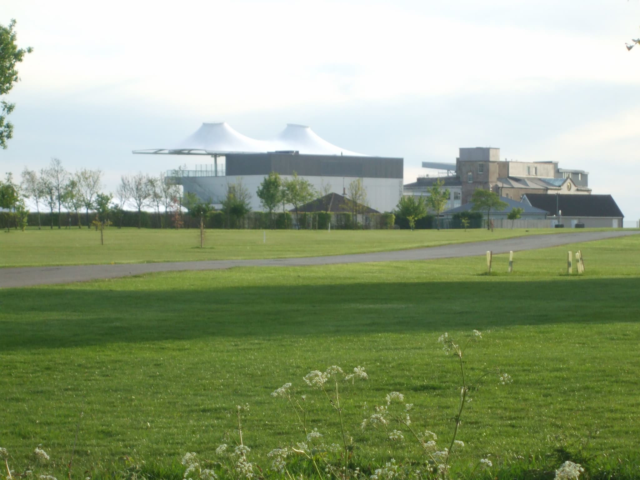 The back of the Bath stands seen across the open ground inside the course.