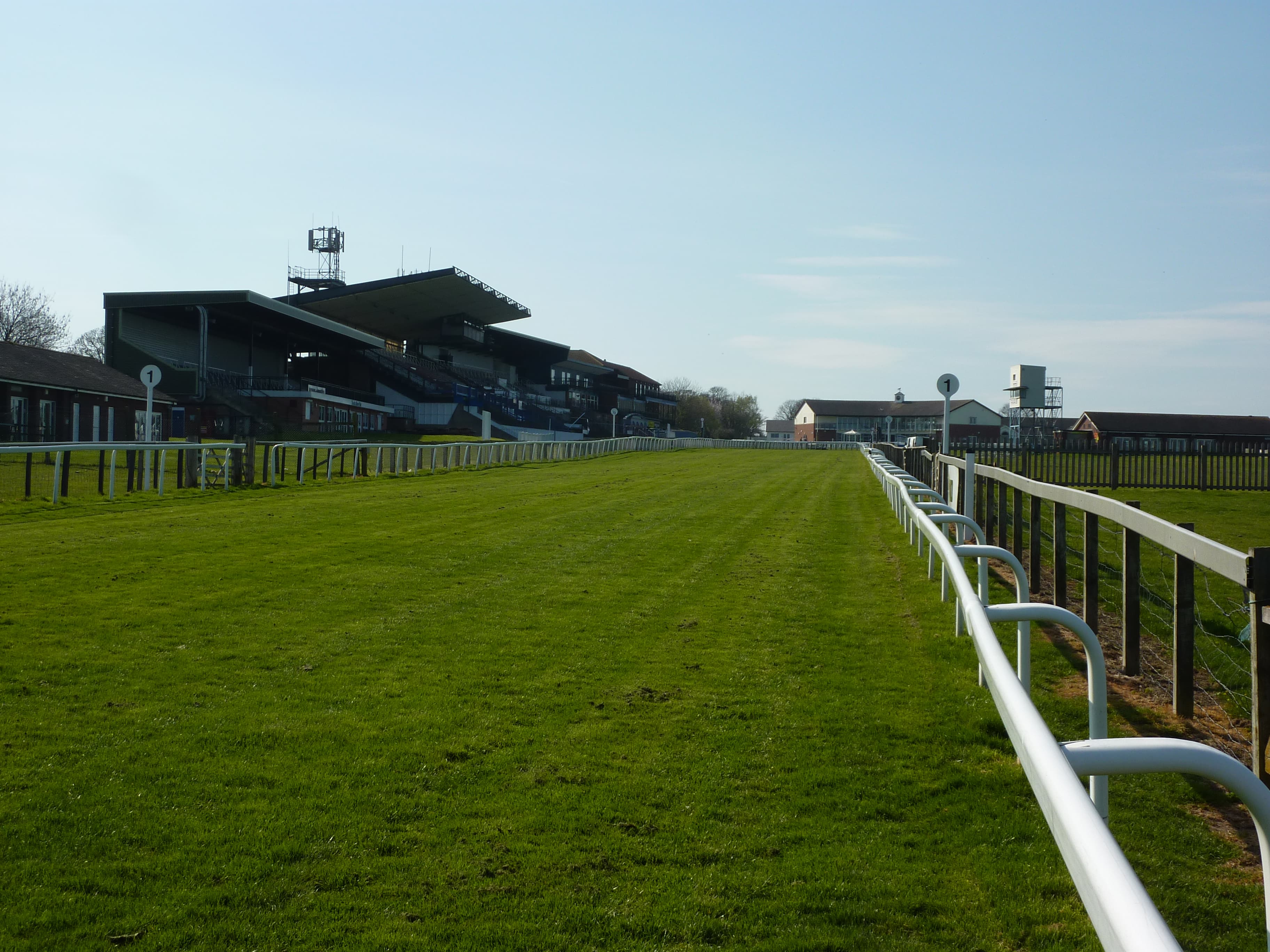 The Beverley grandstand at the end of the straight, the rail running away up the rise of the Westwood.