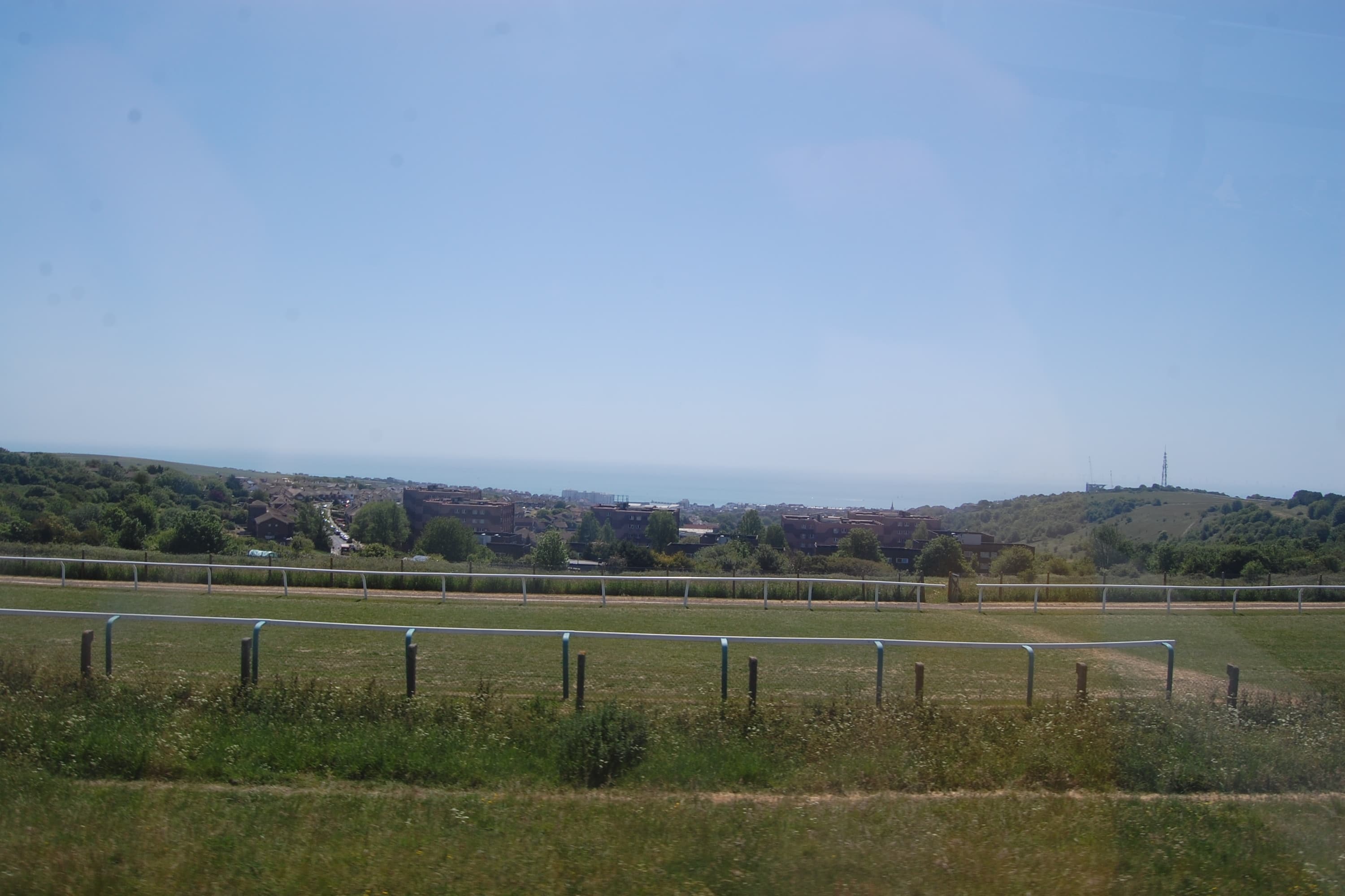 Brighton racecourse on the downs above the city, the sea on the horizon beyond the rooftops.