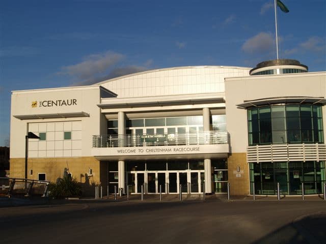 The Centaur building at Cheltenham Racecourse with its welcome sign.