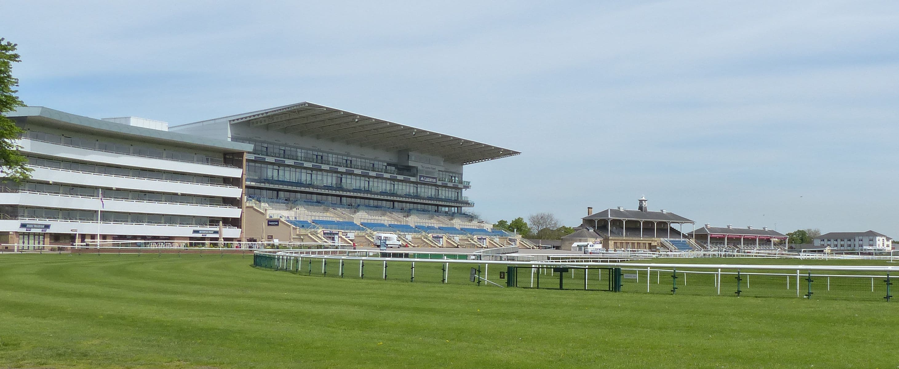 The Doncaster grandstands and the old stand seen along the home straight on a clear spring morning.