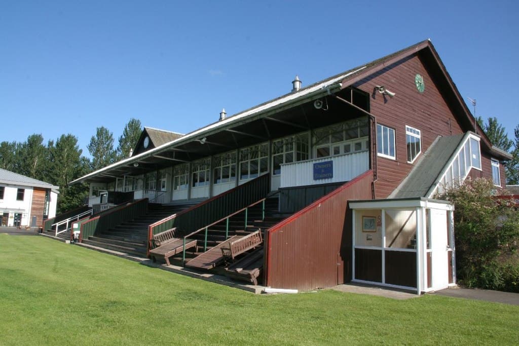 The old timber-clad stand at Perth racecourse, its veranda looking out over the turf.