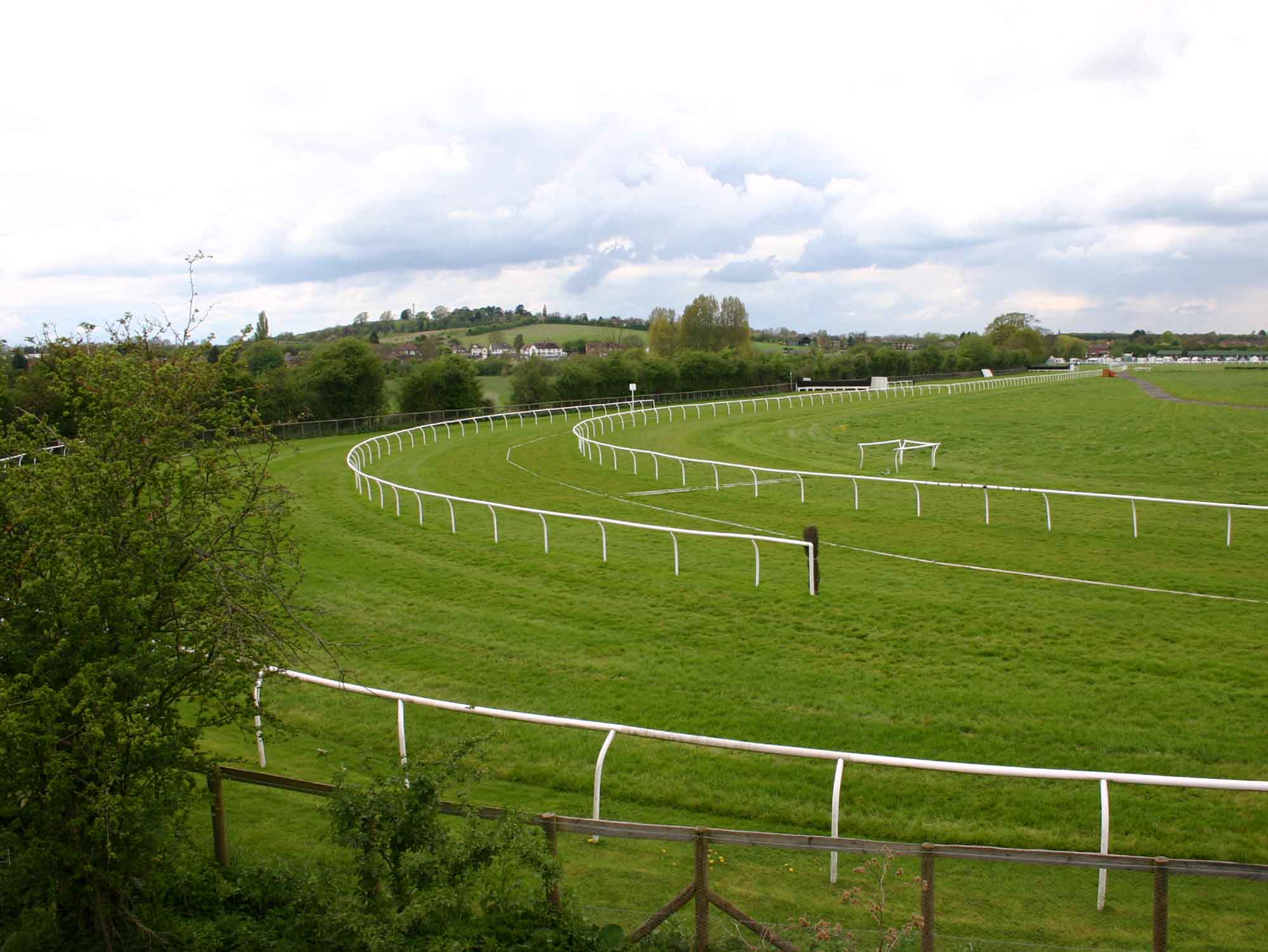Stratford-on-Avon racecourse from the Greenway, the rails sweeping round the bend across flat green turf.