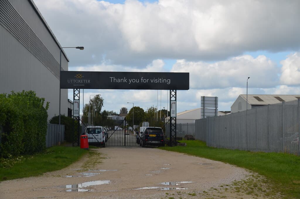 The car park gate at Uttoxeter Racecourse, a Thank you for visiting banner across the entrance frame.